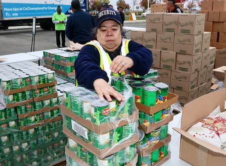West Hills College Thanksgiving food distribution held Nov. 15 Volunteers help sort canned goods before the event started Wednesday morning at WHC Lemoore.